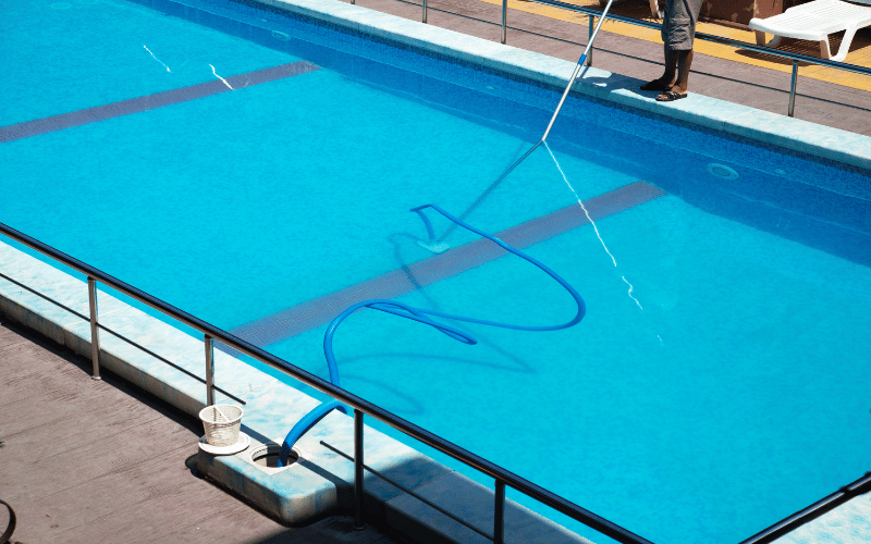 cleaner cleaning the swimming pool