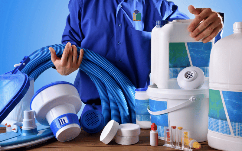 cleaner holding all necessary equipments before cleaning the swimming pool